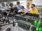 Postgraduální badatelé Shiwei Wu a Gang Han, vedeni Brucem Cohenem, a další vědci Jim Schuck a Delia Milliron, pracovali na vynalezení nanokrystalů, které by obsahovaly vzácné zemské prvky, jež by absorbovaly nízkoenergetické infračervené světlo a přeměňovaly jej na viditelné světlo během několika přenosu energie, při jejich zasažení stálou vlnou, blízko-infračerveného laseru.